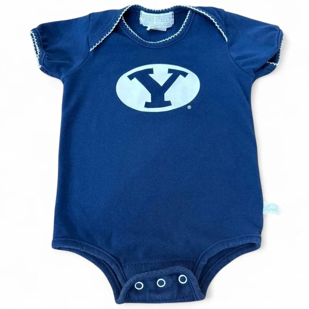 Navy blue BYU baby onesie with trim white stitching